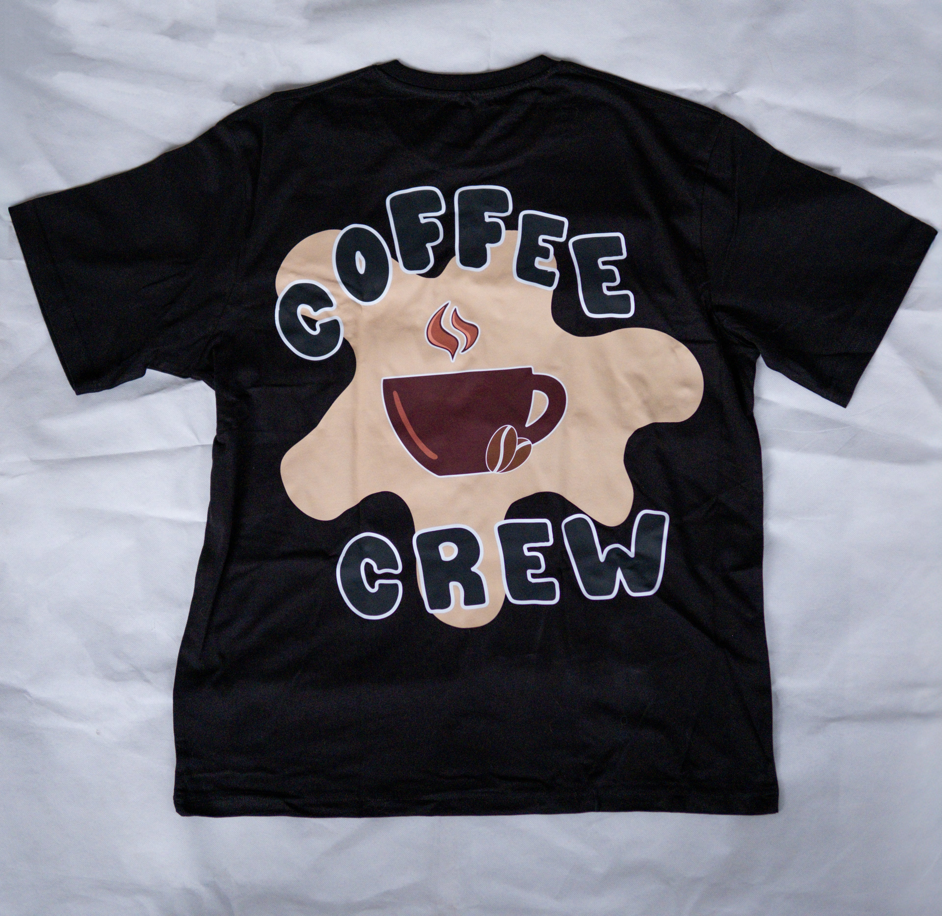 Black t-shirt with 'Coffee Crew' design on a white background