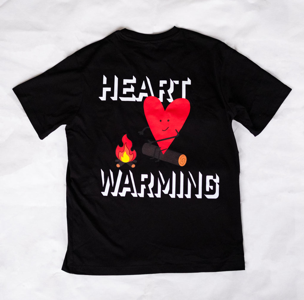 Black t-shirt with a red heart and campfire graphic and 'HEART WARMING' text on a white background