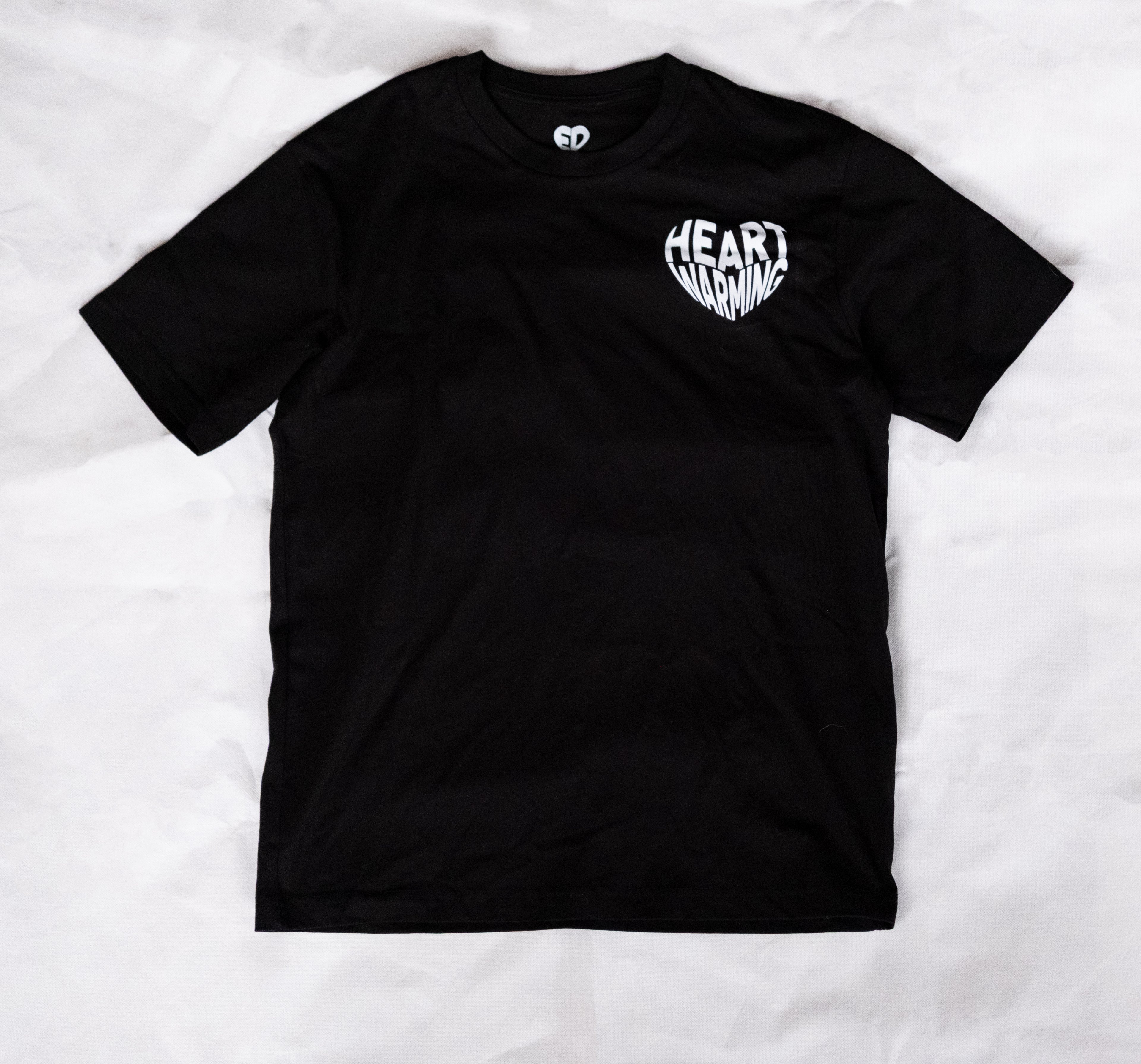 Black t-shirt with white text on a white background