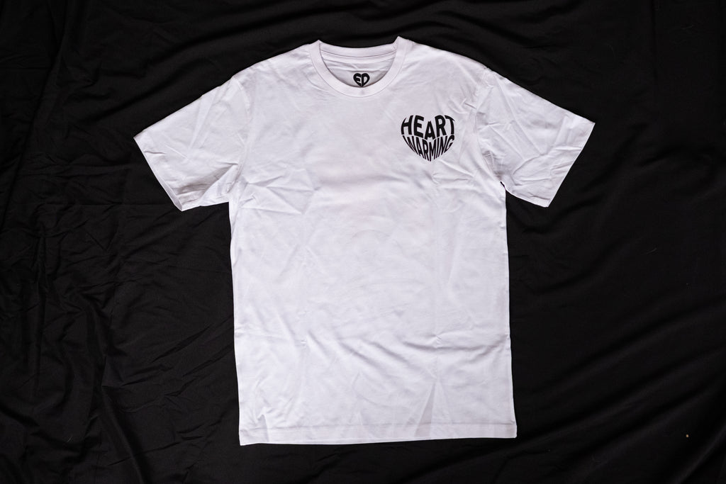 White t-shirt with a logo on a black fabric background