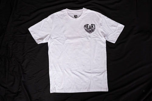 White t-shirt with a logo on a black fabric background