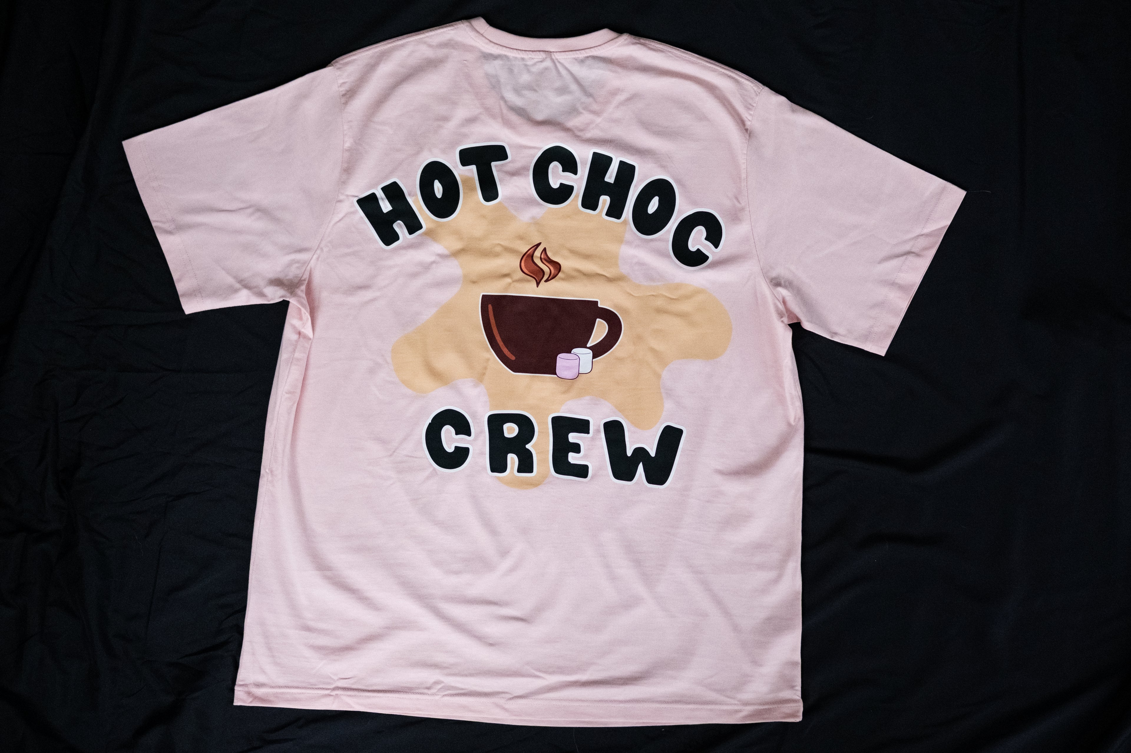 Pink t-shirt with 'Hot Choc Crew' design on a black background