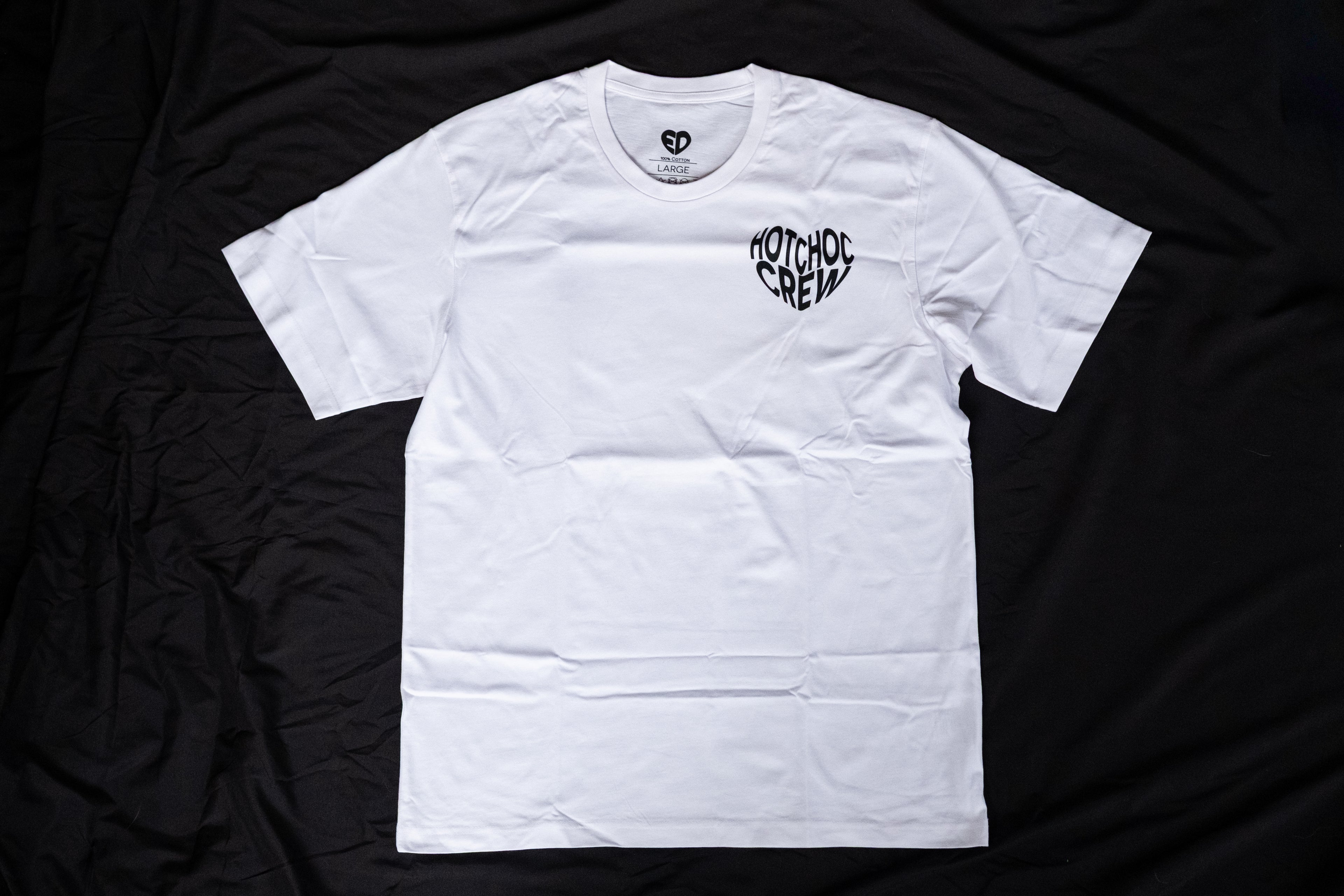 White t-shirt with a logo on a black background