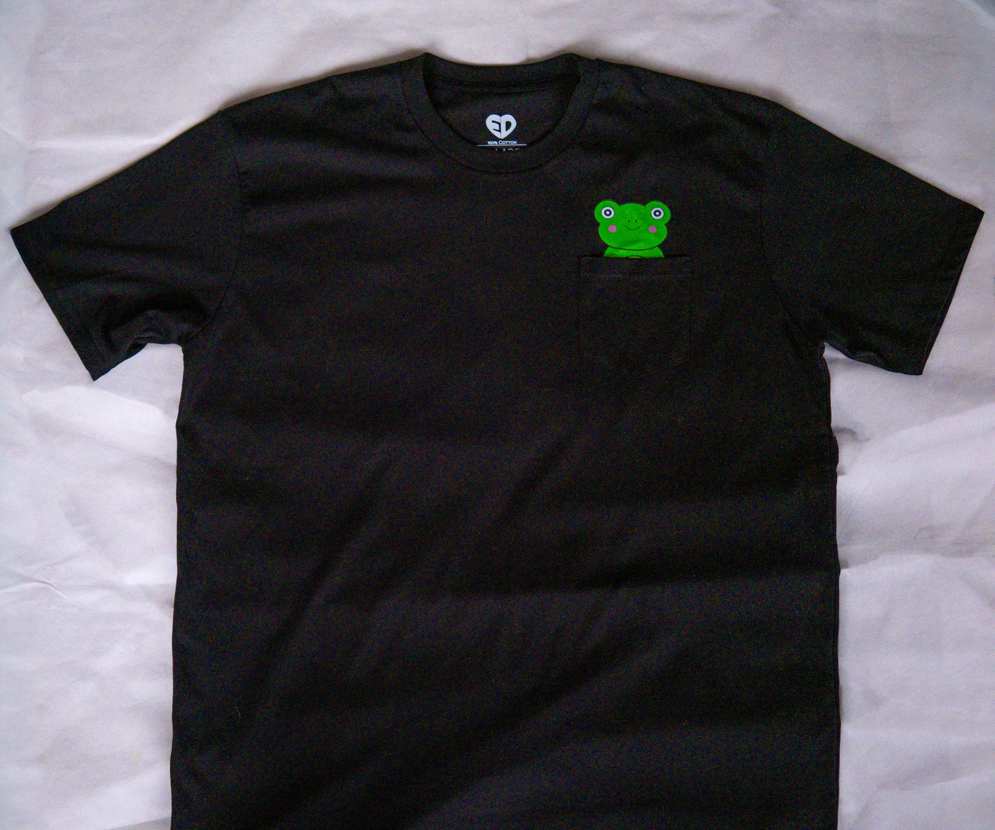 Black t-shirt with a green logo on a white background