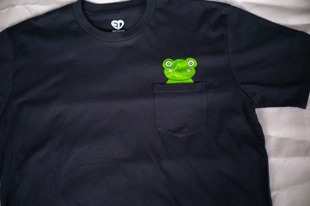 Black t-shirt with a green frog graphic on a white background