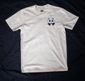 Beige t-shirt with a panda graphic on a dark background